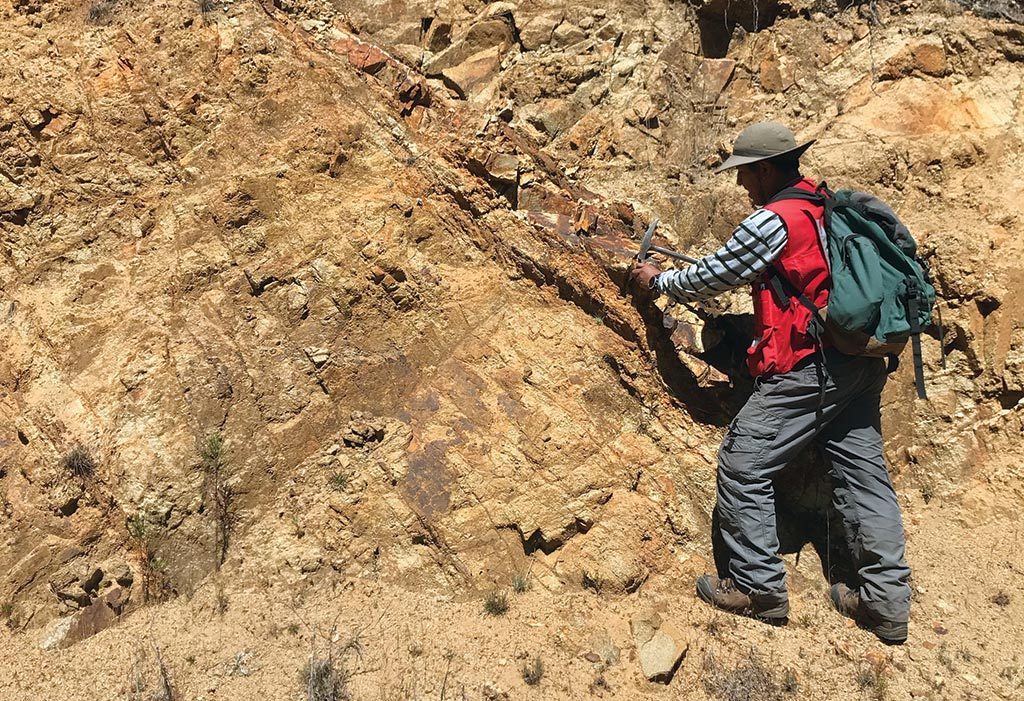 A geologist collects a sample at the Totora target on Auryn Resources’ Sombrero copper project in Peru. Credit: Auryn Resources.