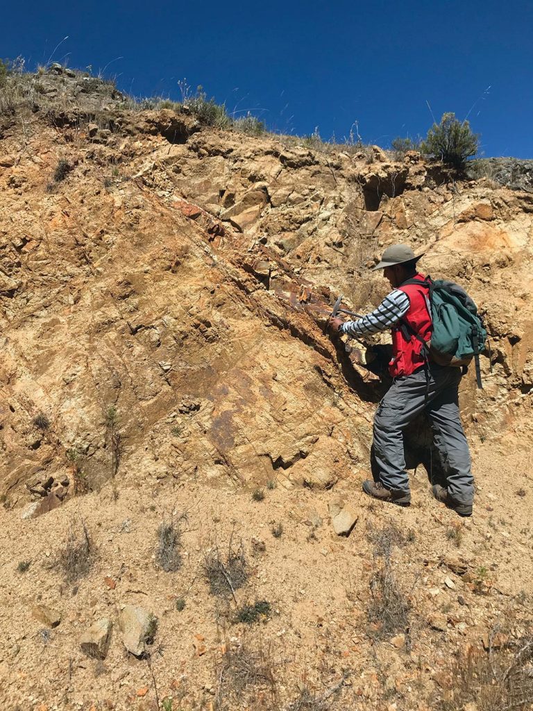 A geologist collects a sample at the Totora target on Auryn Resources’ Sombrero copper project in Peru. Credit: Auryn Resources.