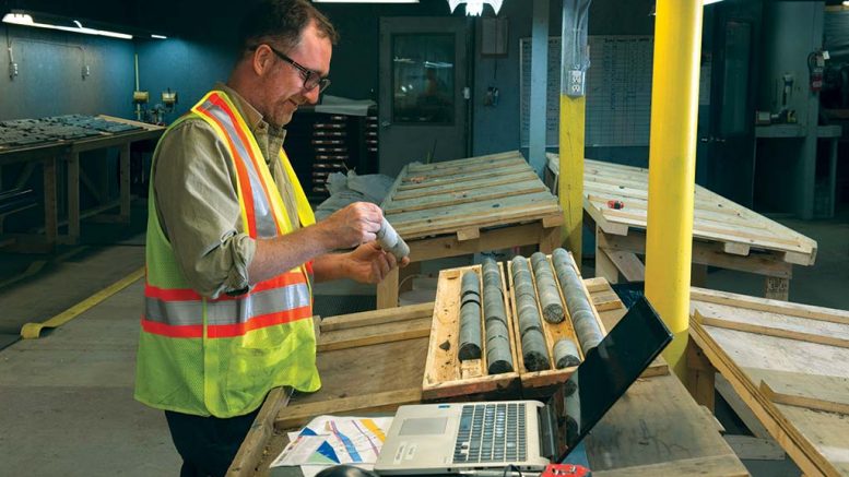 Pure Gold Mining geologist Karl McNamara logging core in the core shack at the Madsen gold project in northwestern Ontario. Credit: Pure Gold Mining.