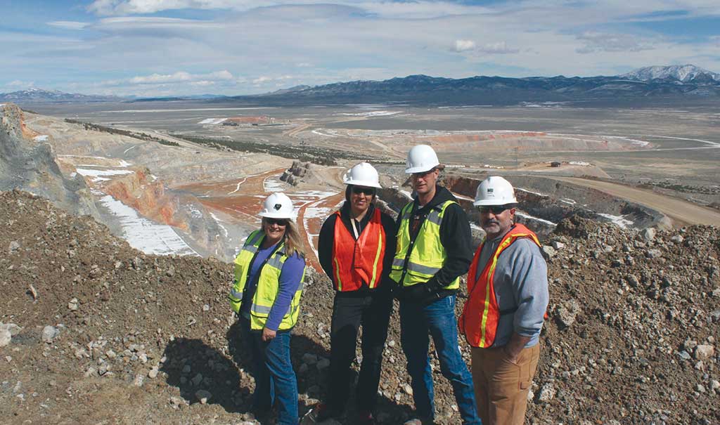 Liberty Gold’s geoscience team on a visit to Newmont Mining’s Long Canyon gold deposit in Nevada, from left: Moira Smith, vice-president of exploration and geoscience; April Barrios, project geologist; Randy Hannink, project geologist; and Pete Shabestari, regional geologist. Missing from the team photo: Will Lepore, project geologist. Smith was instrumental in advancing Long Canyon with Fronteer Gold before Newmont bought the company for $2.3 billion in 2011. Credit: Liberty Gold.