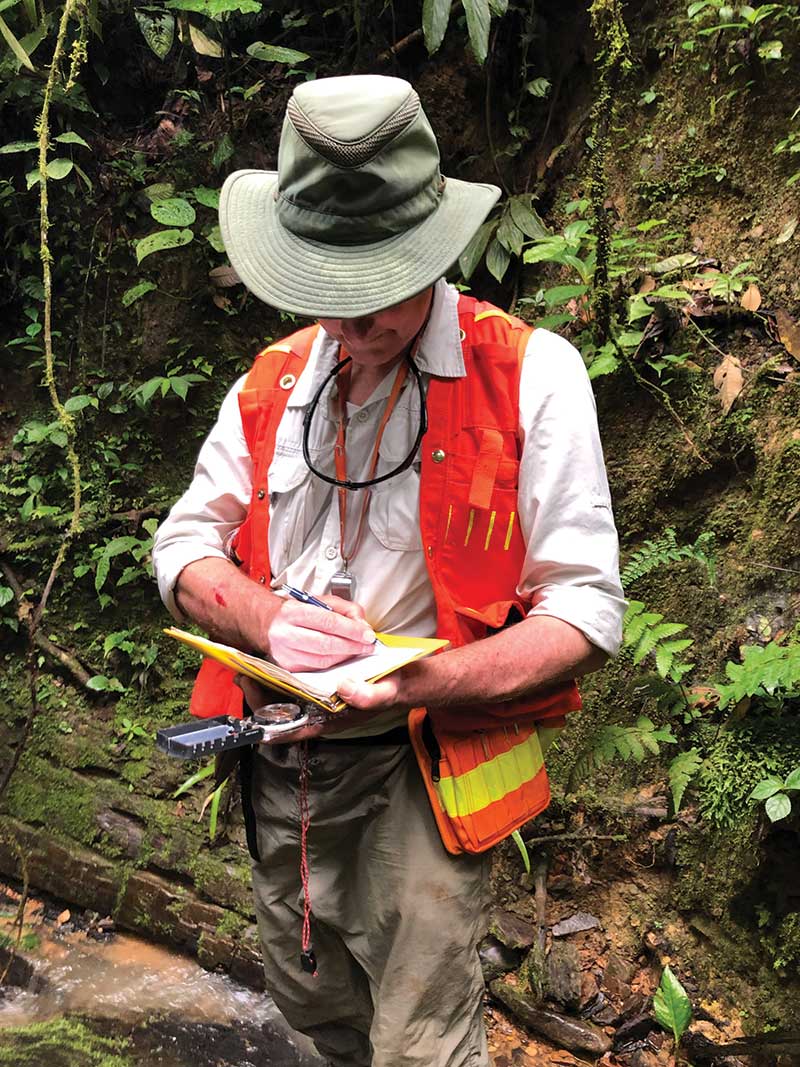Aurania Resources president Richard Spencer taking notes in the field. Credit: Aurania Resources.