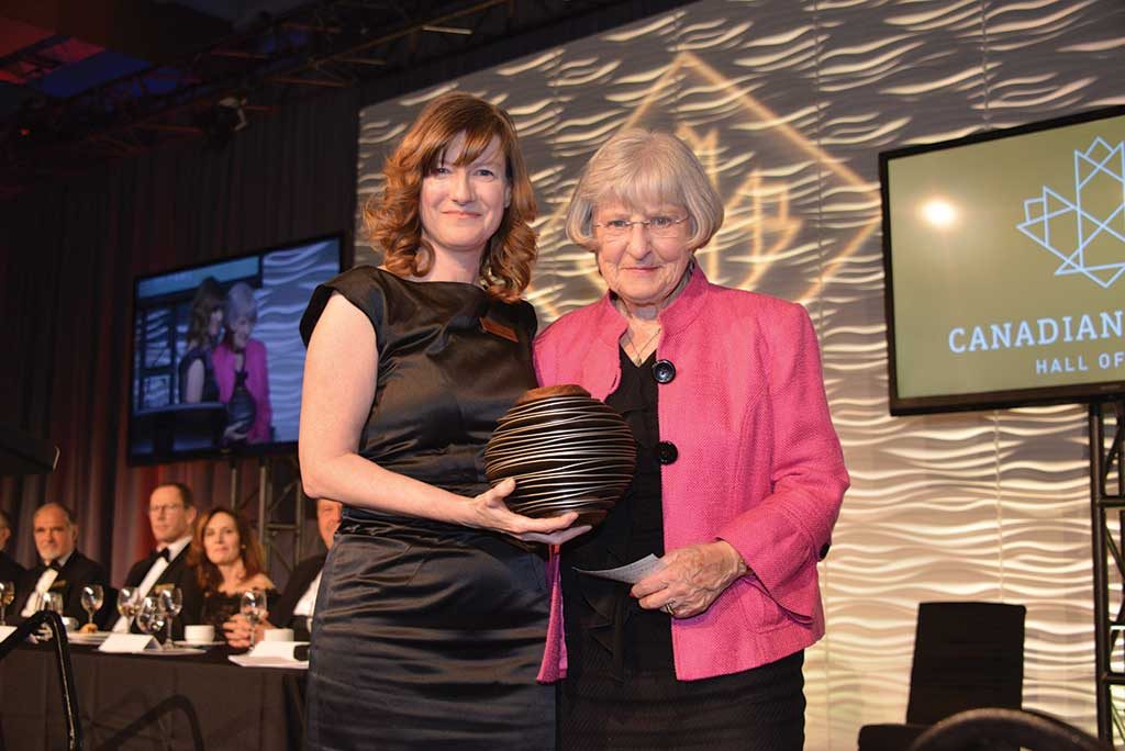 Lisa McDonald (left), PDAC executive director, presenting to Janet Meikle (widow of Brian Meikle). Photo by Keith Houghton.
