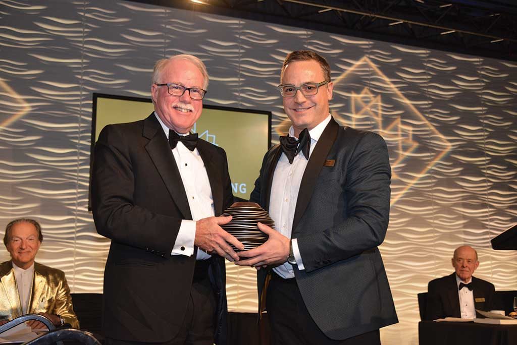 Northern Miner Group publisher and CMHF director Anthony Vaccaro (right)presenting to James Gill. Photo by Keith Houghton.