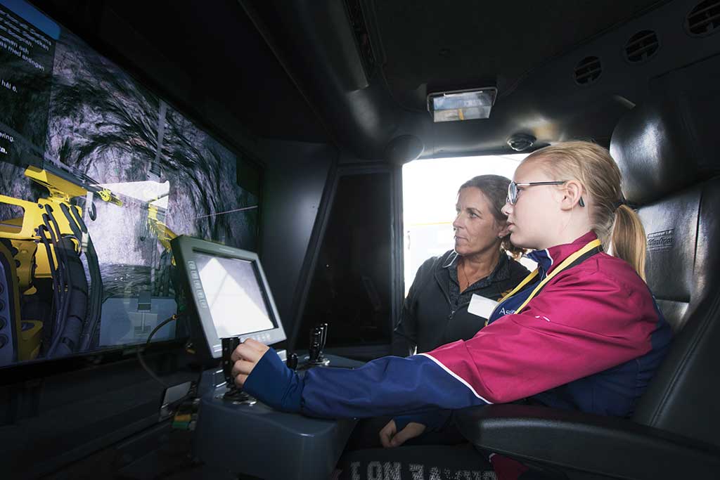The third-place photo shows a girl using a drilling simulator at Lundin Mining’s Zinkgruvan mine in Sweden. Credit: Lundin Mining.