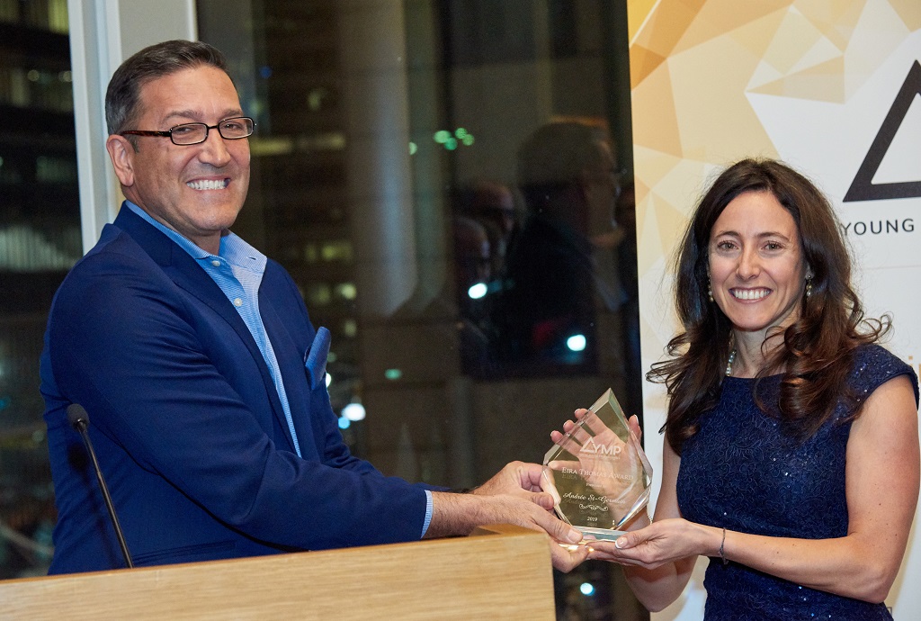 George Salamis, president and CEO of Integra Resources, presents the YMP’s Eira Thomas Award for 2018 to Andrée St-Germain, chief financial officer of Integra Resources. Credit: YMP.