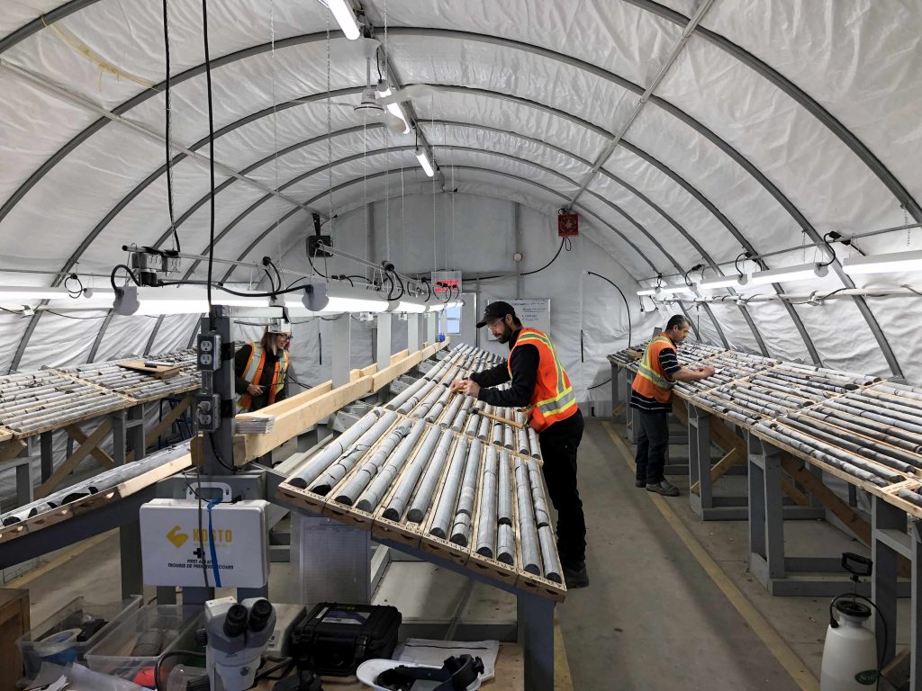 Workers examine drill core at Wallbridge Mining’s Fenelon gold project in northwestern Quebec. Credit: Wallbridge Mining.
